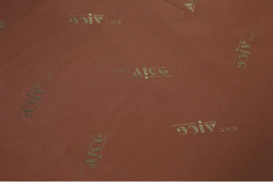 Φόδρα βισκόζ ασετάτ μπρούτζινο χρώμα 150cm φάρδος με μοτίβο γράμματα