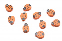 Wooden beads in the shape of a ladybug in black and orange