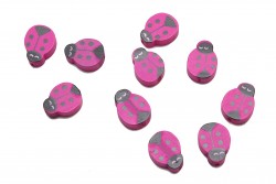 Wooden beads in the shape of a ladybug in black and fuchsia 